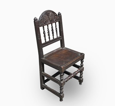 Lot 99 - A Charles II joined oak backstool,...