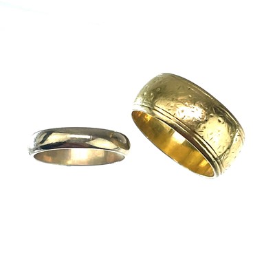Lot 184 - A 22ct gold wide chased band 7.5gm size J/K and a small 9ct band 1.6gm.