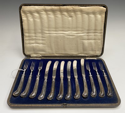 Lot 65 - A set of six dessert knives and forks with the...