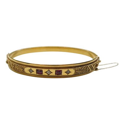 Lot 2800 - A 15ct gold Edwardian bangle set with three...