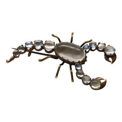Lot 2801 - A gold moonstone set scorpion brooch.