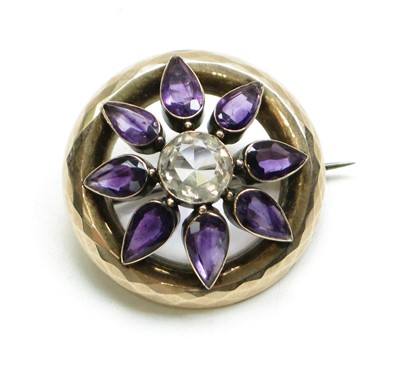 Lot 2802 - A 9ct gold amethyst and white stone set brooch.