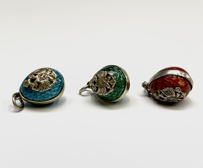 Lot 361 - Three enamelled miniature eggs each with the...