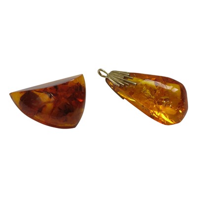 Lot 2804 - An amber brooch and an amber pendant, each...