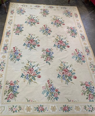 Lot 3107 - A needlepoint rug, the cream ground decorated...