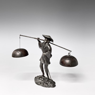 Lot 357 - A Japanese metal figure of a man, early 20th...