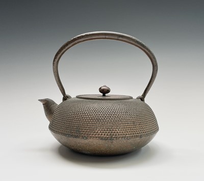 Lot 16 - A Japanese iron teapot, 19th century,...