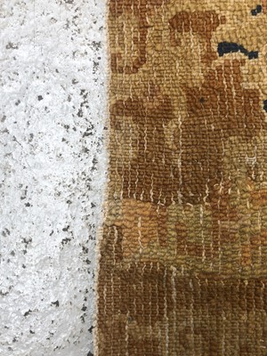 Lot 1279 - A Chinese rectangular rug fragment, 19th...
