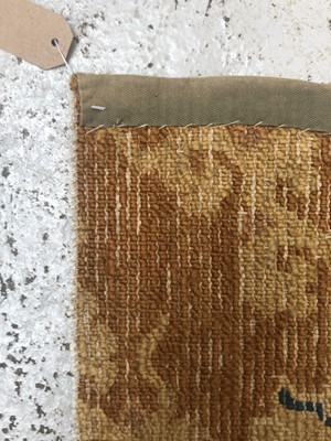 Lot 1279 - A Chinese rectangular rug fragment, 19th...