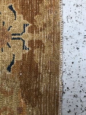 Lot 1279 - A Chinese rectangular rug fragment, 19th...