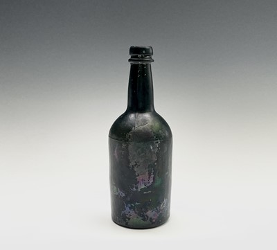 Lot 824 - A 19th century green glass bottle. Height 21cm
