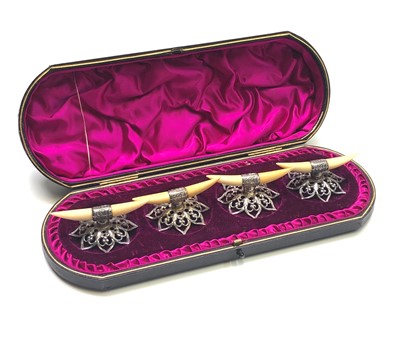 Lot 2016 - A set of four late Victorian pierced silver...