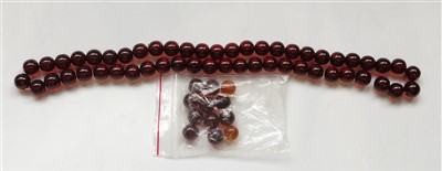 Lot 2747 - A ''cherry amber'' necklace and some loose...