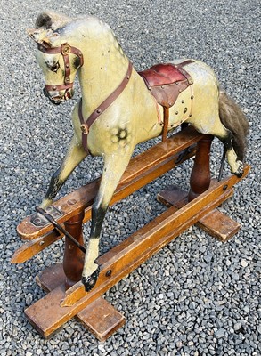 Lot 654 - Child's wooden rocking horse. An early 20th...