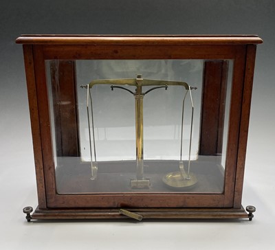 Lot 435 - A brass precision laboratory balance, by W & T...