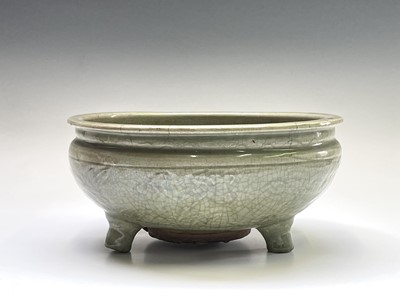 Lot 10 - A Chinese Longquan celadon tripod censer, Ming...