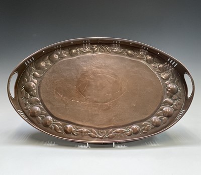 Lot 3 - A Newlyn copper oval tray, circa 1910, the...