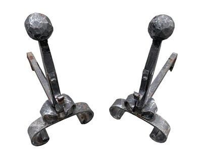 Lot 180 - A pair of wrought iron fire dogs, mid 20th...