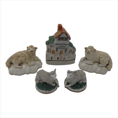 Lot 1316 - A pair of Staffordshire porcelain recumbent...