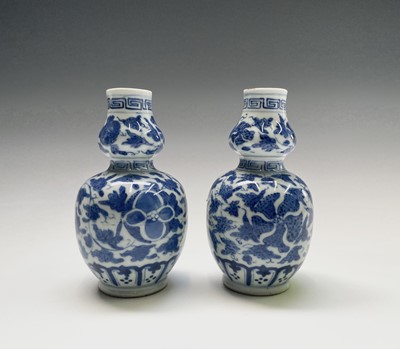 Lot 78 - A pair of Chinese double gourd porcelain vases,...
