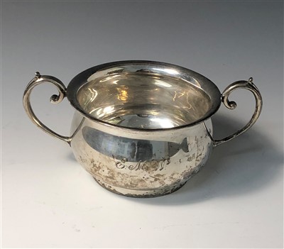 Lot 2019 - A bellied silver twin handled bowl