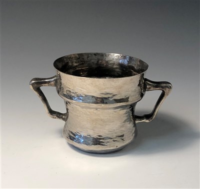 Lot 2014 - An Arts & Crafts silver hammered twin handled cup