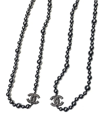 Lot 209 - Chanel black pearl necklace. Very long black...