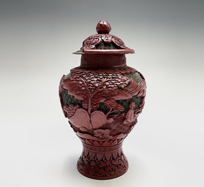 Lot 86 - A Chinese cinnabar lacquer vase and cover,...