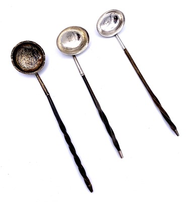 Lot 42 - A pair of George III silver toddy ladles with...