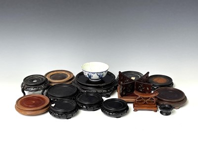 Lot 309 - A collection of Chinese hardwood stands,...