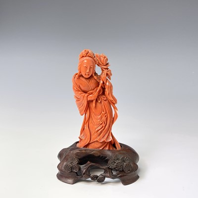 Lot 367 - A Chinese carved coral figure of Guanyin...