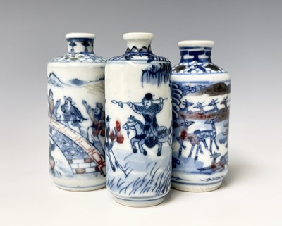 Lot 334 - Three Chinese blue and white porcelain snuff...