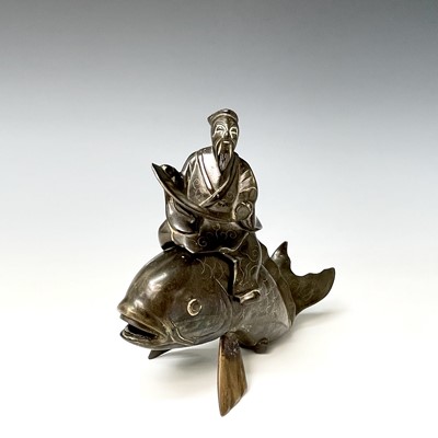 Lot 317 - A Chinese bronze and white metal inlaid group...