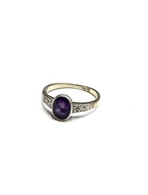 Lot 193 - An 18ct white gold ring set an amethyst with...