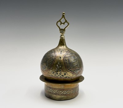 Lot 1058 - An Islamic Cairoware brass incense burner,...