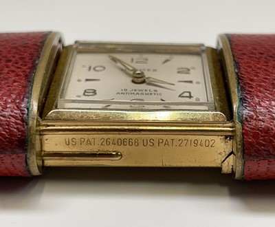 Lot 12 - A Hermes 15 jewel purse timepiece in gold...