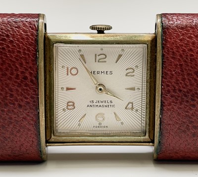 Lot 12 - A Hermes 15 jewel purse timepiece in gold...
