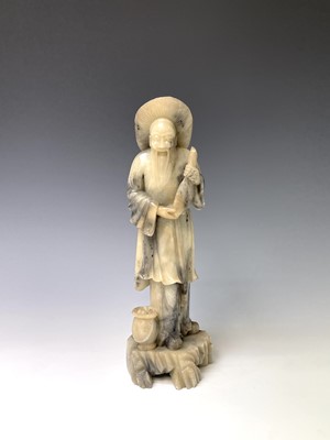 Lot 383 - A Chinese white soapstone figure, 20th century,...