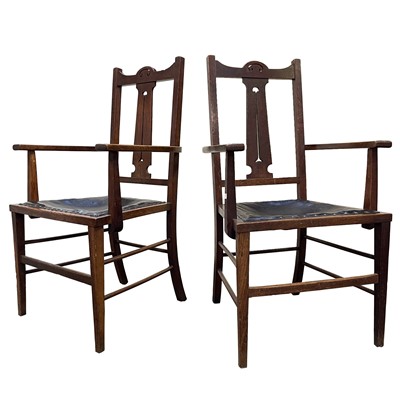 Lot 3122 - A pair of Arts and Crafts oak open armchairs,...