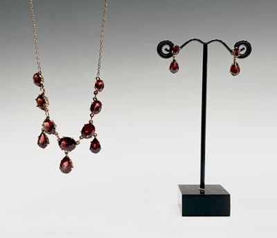 Lot 214 - A 9ct gold red stone set necklace and a pair...
