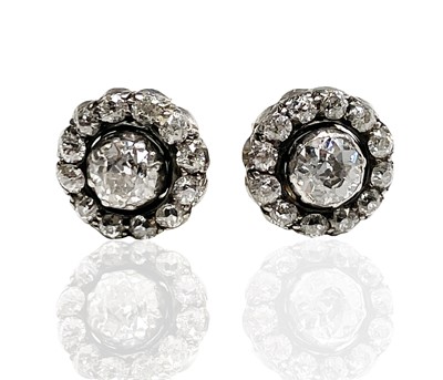 Lot 223 - A pair of diamond cluster earrings, each head...