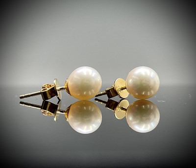 Lot 242 - A pair of Akoya 7.5mm pearl ear studs in 18ct...