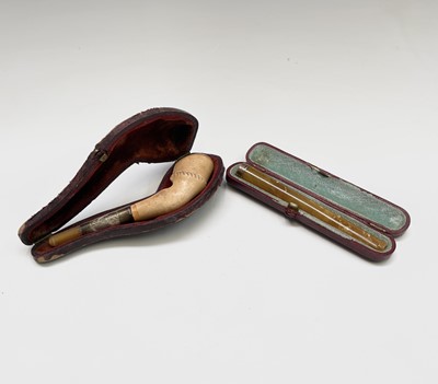 Lot 480 - A gold-mounted cigarette holder, cased and a...