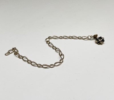 Lot 466 - An 18ct gold diamond and sapphire set pendant...