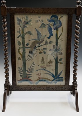 Lot 3135 - An early 20th century oak firescreen with...