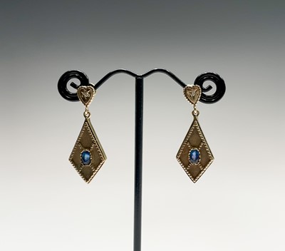 Lot 341 - A pair of 9ct gold earrings each set a...