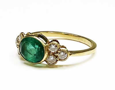 Lot 350 - An emerald and diamond ring, the oval emerald...