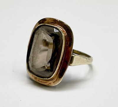 Lot 281 - A stylish gold ring set with a brown topaz...