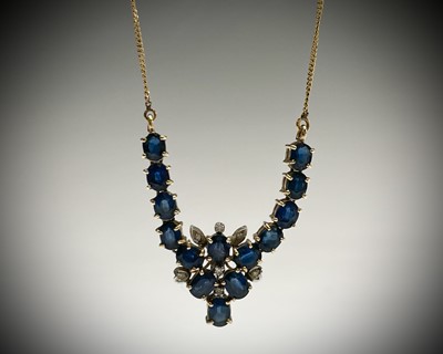 Lot 285 - A 14ct gold necklace set with sapphires and...
