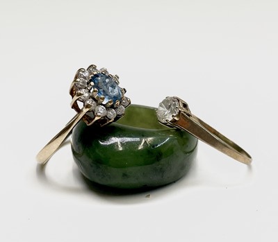 Lot 301 - A jade ring Size P and two gold rings set with...